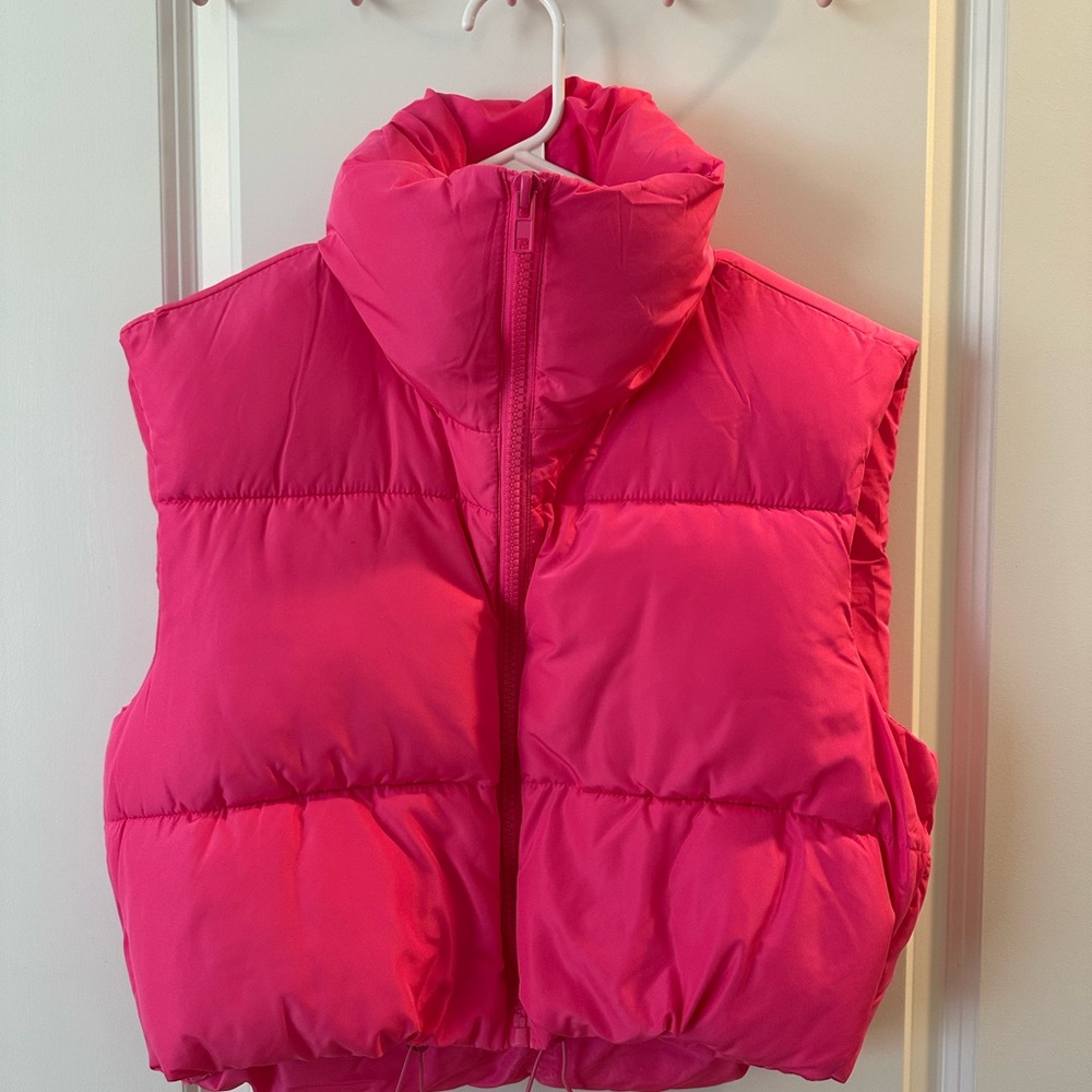 Bright pink cropped puffer vest